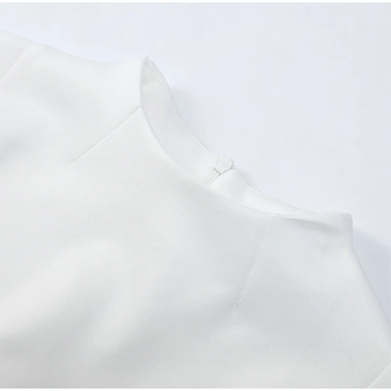 Close-up of a white shirt with a collar on a light gray background