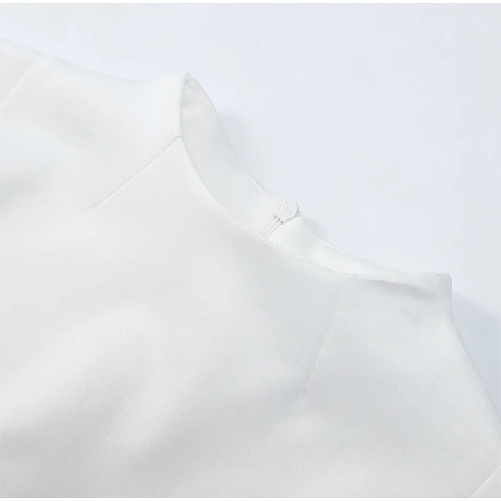 Close-up of a white shirt with a collar on a light gray background