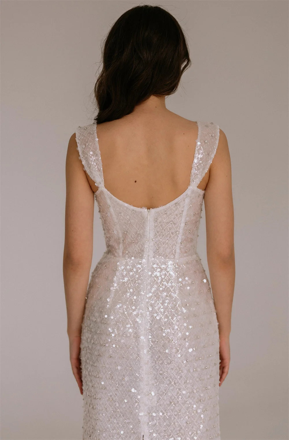 Maxi Dress epitomizes bridal elegance with its lustrous ivory sequin embellishment and refined silhouette