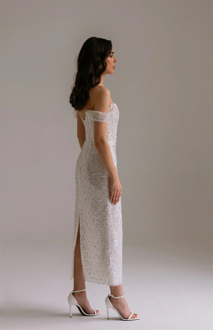 Maxi Dress epitomizes bridal elegance with its lustrous ivory sequin embellishment and refined silhouette