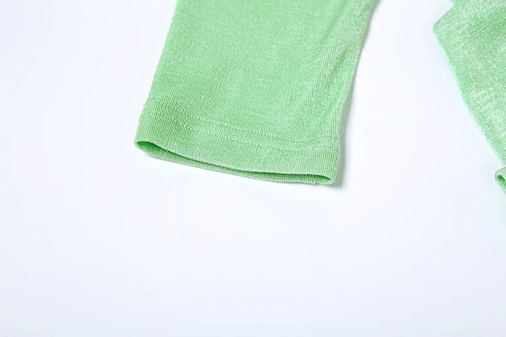 Green towel on a white background