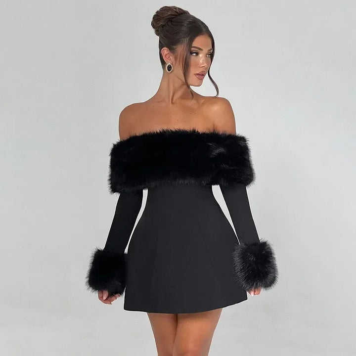 Black off-shoulder dress with fur accents worn by a model on a gray background
