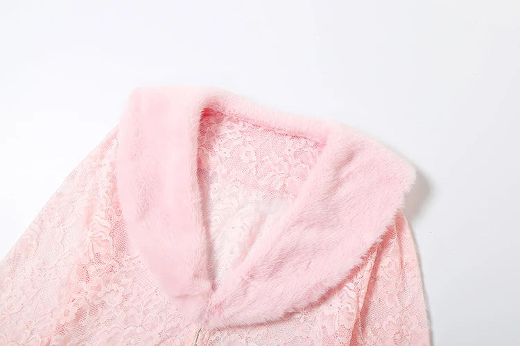 Close-up of a pink fluffy hooded garment on a white background