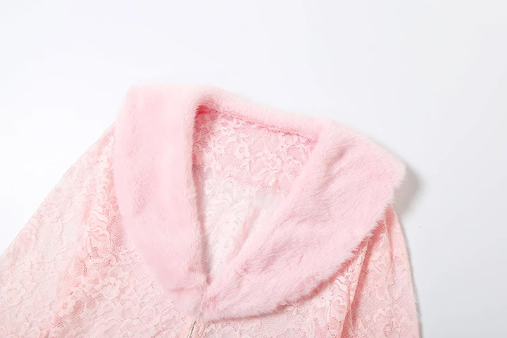 Close-up of a pink fluffy hooded garment on a white background