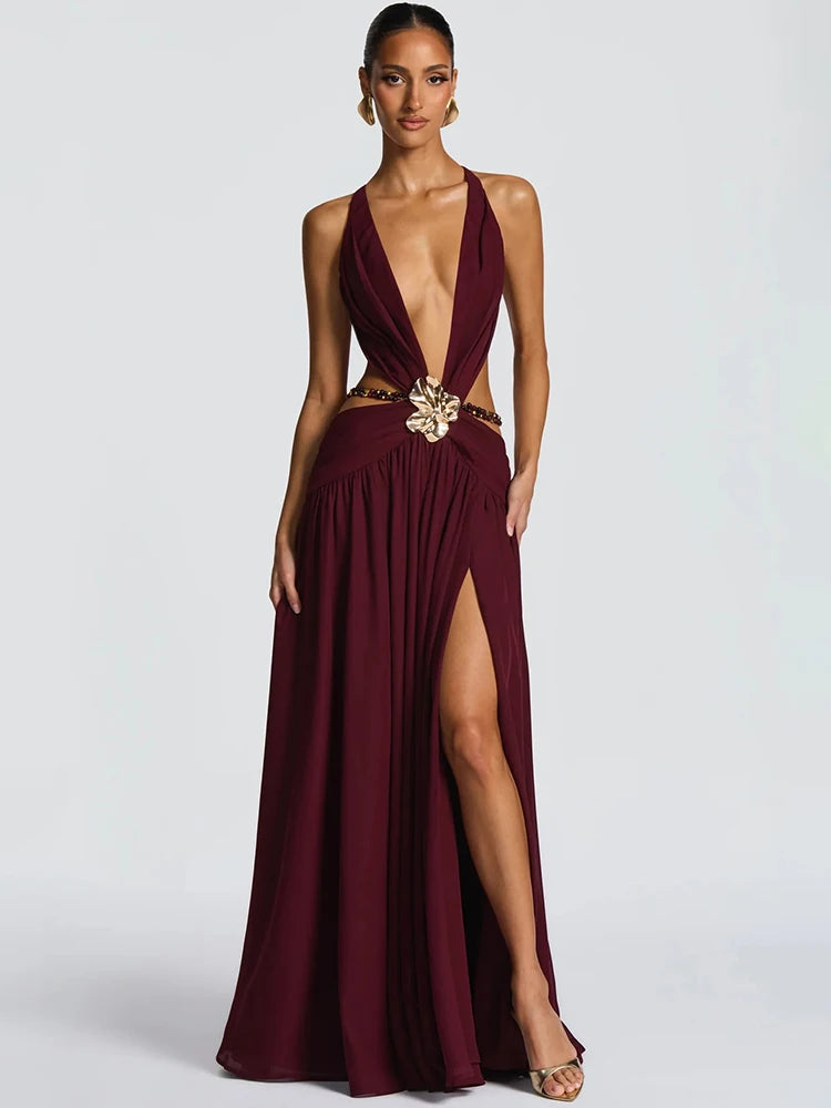 Burgundy evening gown with a high slit on a white background
