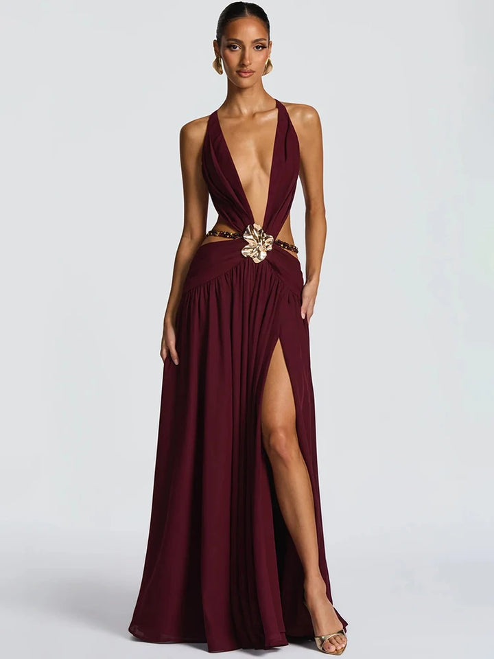 Burgundy evening gown with a high slit on a white background