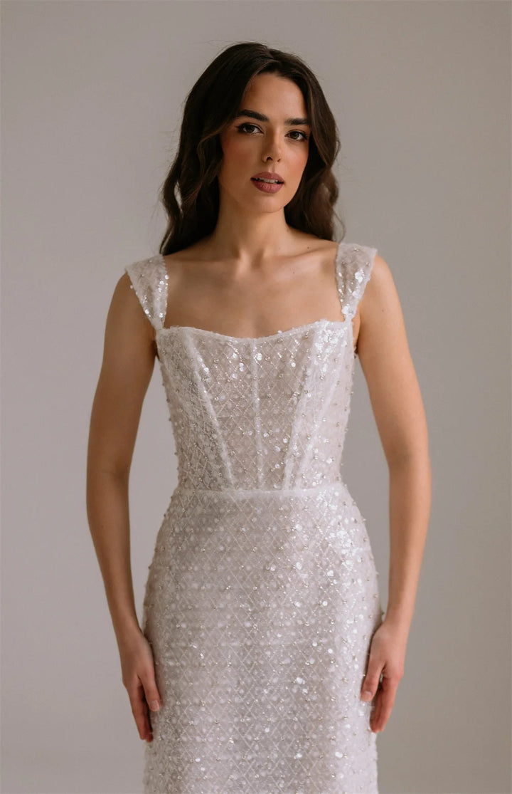 Maxi Dress epitomizes bridal elegance with its lustrous ivory sequin embellishment and refined silhouette