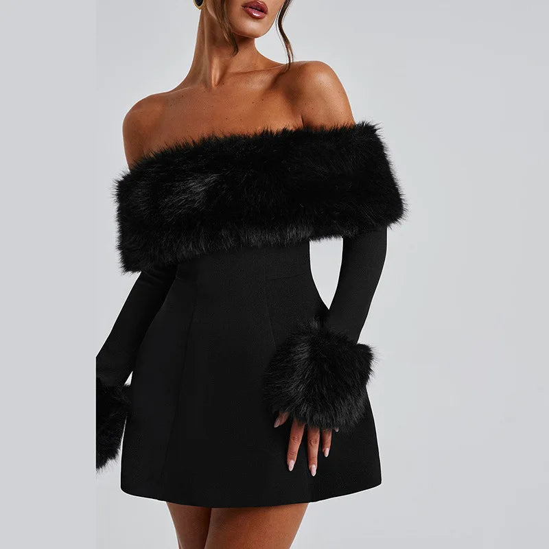 Black strapless dress with fur accents on a plain background