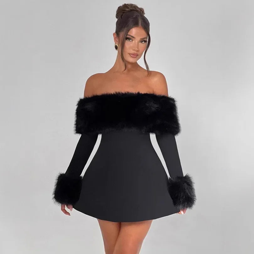 Black off-shoulder dress with fur accents worn by a model on a gray background