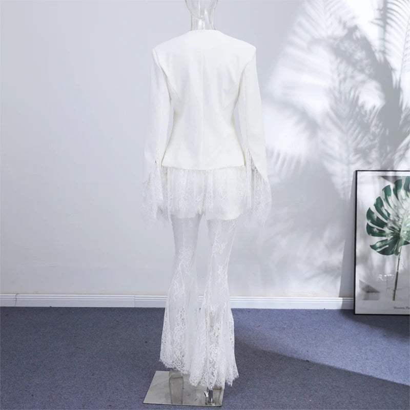 White outfit on a mannequin against a white wall with a plant in the background
