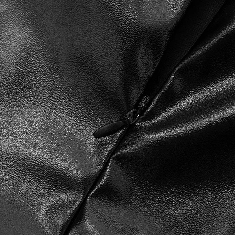 Close-up of a black leather texture with a zipper