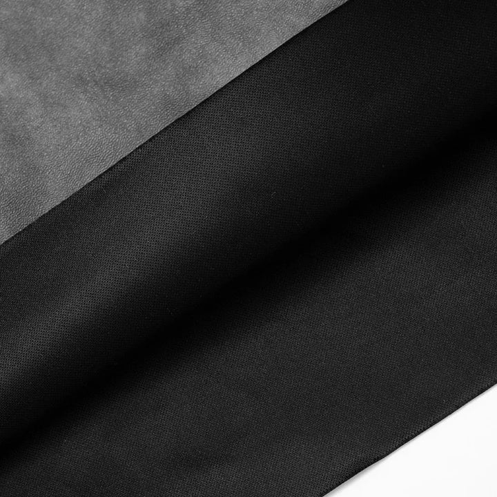 Two different textures of black fabric on a gray background