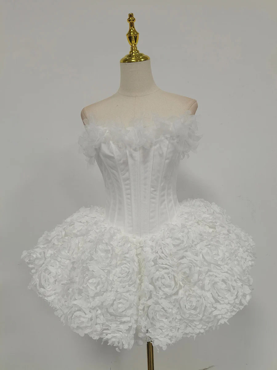 White lace dress on a mannequin against a gray background