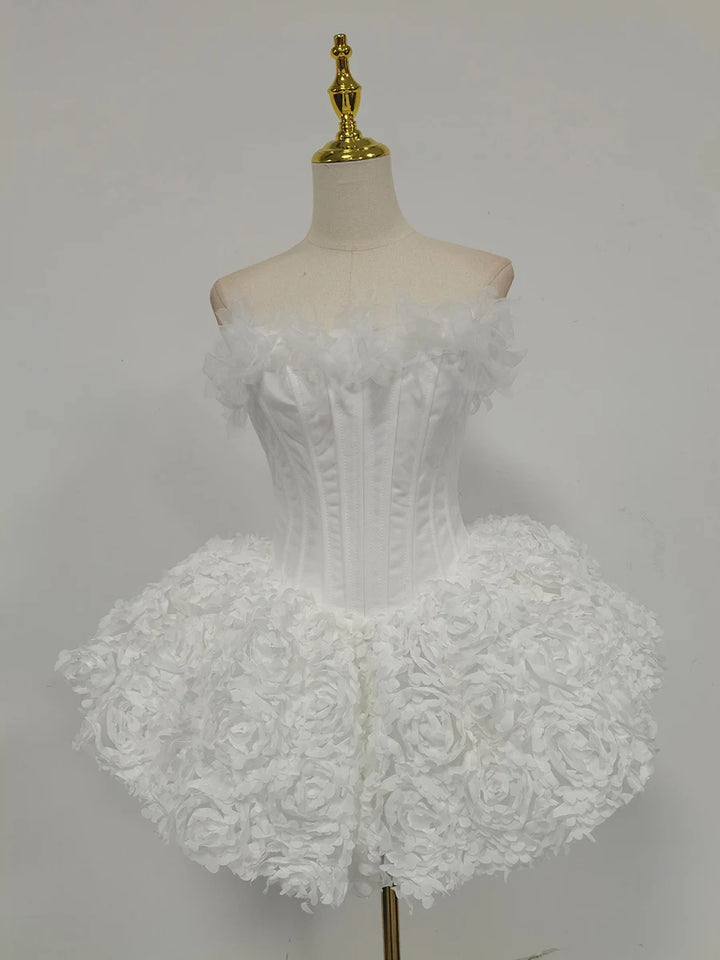 White lace dress on a mannequin against a gray background
