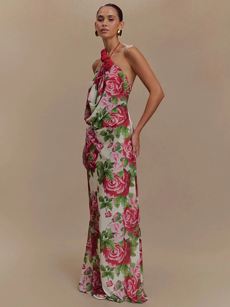 Woman wearing a floral halter neck gown on a beige background