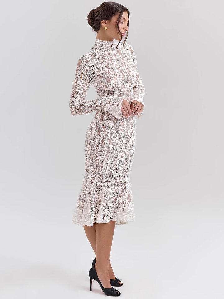 Woman wearing a white lace dress on a light gray background