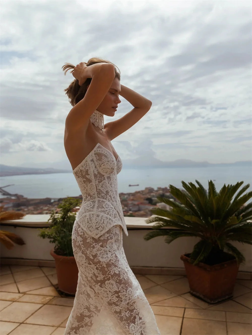 Maxi Dress is a striking off-white lace wedding gown designed for the modern bride seeking timeless elegance with contemporary edge