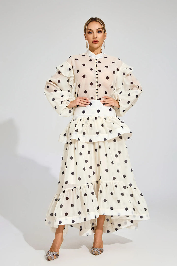 Woman wearing a polka dot outfit on a white background
