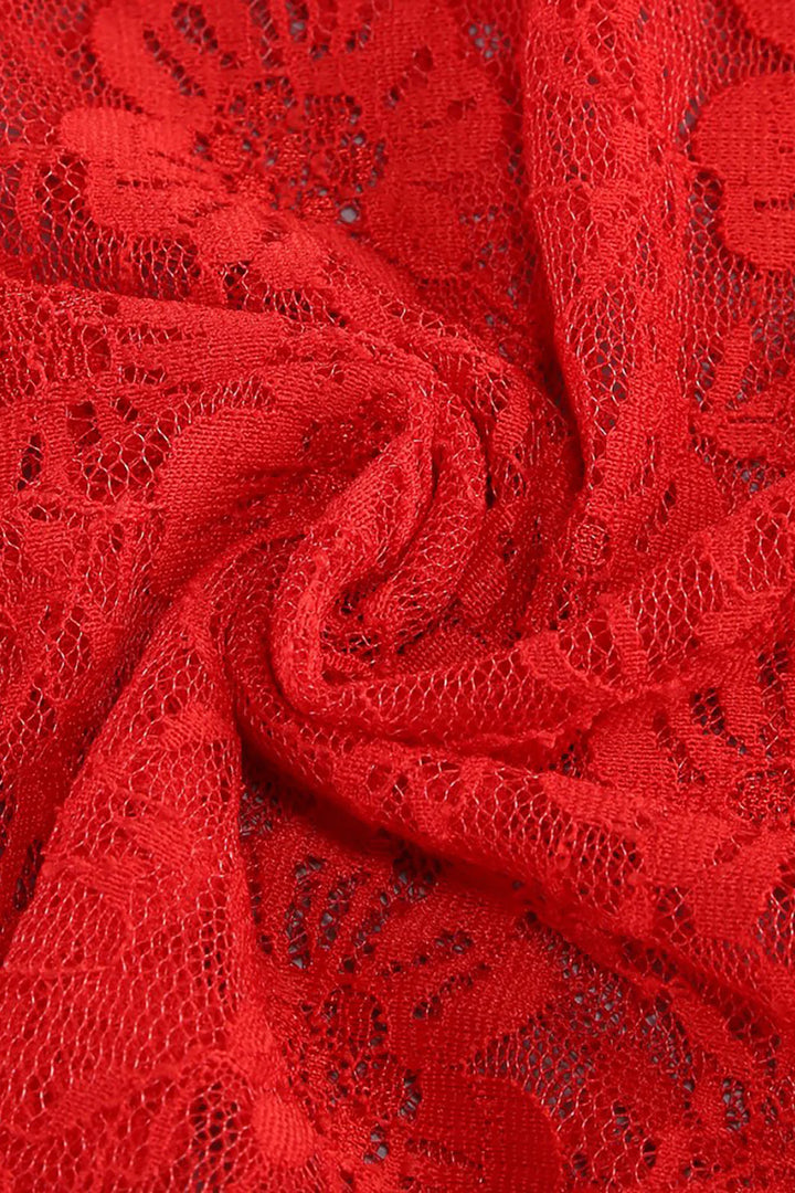 Close-up of red lace fabric with intricate patterns